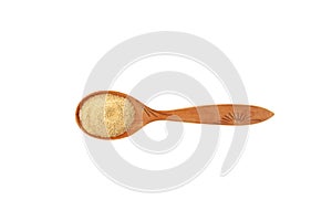 Fenugreek powder or Hulbah extract in wooden spoon on white background, top view