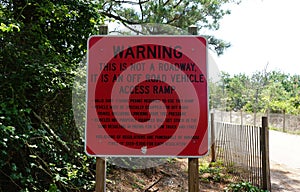 Fenwick Island, Delaware, U.S - July 8, 2023 - The warning sign to inform the drivers of the valid access with surf fishing beach