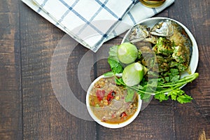 Fermented fish spicy dip Nam Prik Pla-ra served wiht fried mackerel and fresh vegetable photo