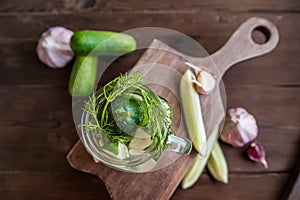 Fermented food in a can. Cucumbers, dill, garlic, marinade. National Russian food pickles in brine copy space