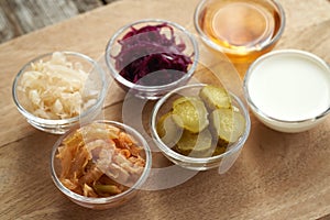 Fermented foods and vegetables - kimchi, purple and white sauerkraut, apple cider vinegar, gherkins and kefir