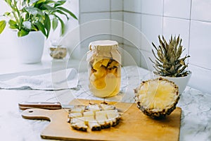 Fermented pineapple kombucha drink tepache. Cooking process of homemade probiotic superfood pineapple beverage. Drink