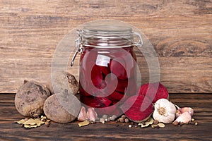 Fermented red beetroots in a jar, preparation of kvass, healthy probiotic food