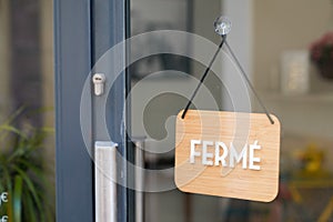 FermÃ© vintage wooden panel door windows shop sign ferme french text means closed board store