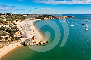 Ferragudo with the Praia Grande (the main beach) and the river Rio Arade, Algarve, Portugal.