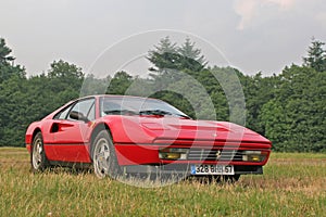 Ferrari 328 in the grass