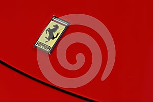 Ferrari logo on red sport car