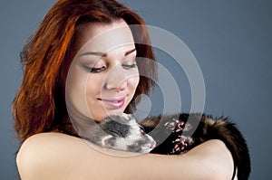 Ferret sleeping on woman's hands