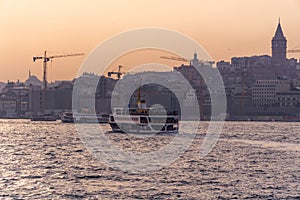 Ferries of istanbul, also known as vapur. Marmara sea and Istanbul cityscape in the background. Bosphorus ride photo