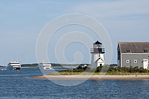 Ferries Pass By Lighthouse on Cape Cod