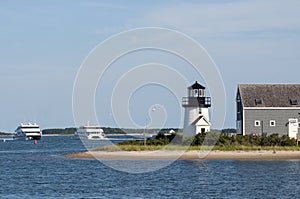 Ferries Pass By Lighthouse on Cape Cod photo