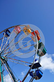 Ferris Wheel Against a Blue Sky