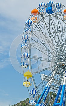 Ferris wheel against the blue sky