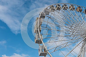 Ferris wheel against blue sky as background