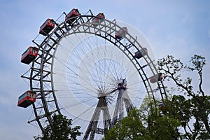 Ferris wheel against a blue sky on a spring evening