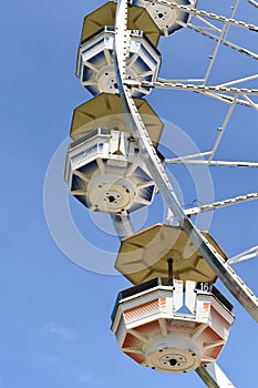 Ferris wheel against a bright blue sky