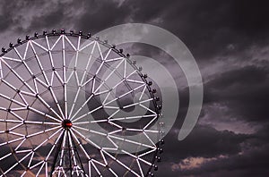 Ferris wheel against the dark sky