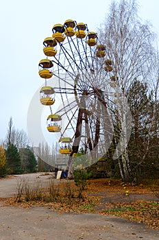 Ferris wheel in amusement park in dead abandoned ghost town of Pripyat, Chernobyl exclusion zone, Ukraine