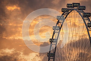 Ferris Wheel on the background of evening sky