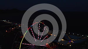 Ferris Wheel on the Background of the Sea at sunset. View from above