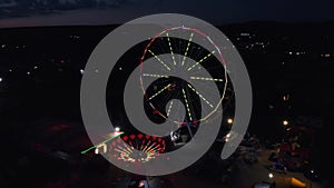 Ferris wheel on the background of the sea at sunset. view from above