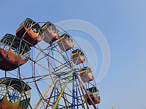The ferris wheel. Banjar, Indonesia, Oktober 04, 2022, wahana permainan the ferris wheel with blue sky