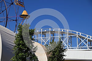 Ferris wheel Big Dipper train ride In Melbourne VIC Australia on a sunny blue sky day