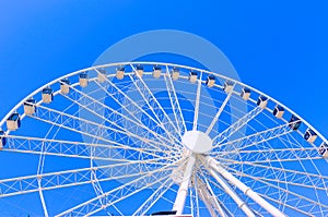 Ferris wheel on a blue sky