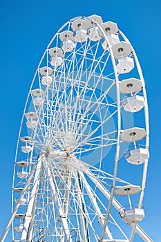 Ferris wheel on blue sky