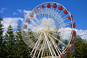 Ferris wheel on blue sky