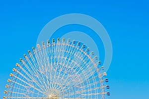 Ferris Wheel with Blue Sky .