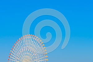 .Ferris Wheel with Blue Sky