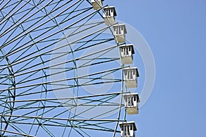 Ferris wheel with blue sky background