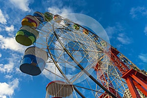 Ferris wheel blue sky clouds