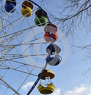 Ferris wheel with bright booths in the Park