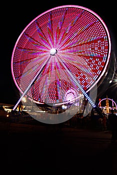 Ferris Wheel and Carnival Fair at Night