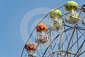Ferris wheel with carriages.