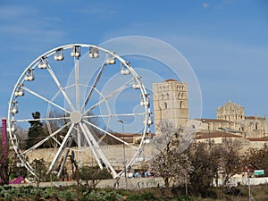 Ferris wheel with cathedral background Zamora party attraction fair photo
