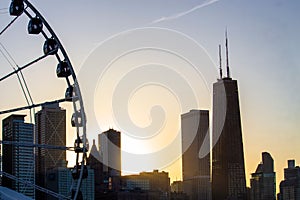 Ferris wheel with city skyline against sunset at Navy Pier,Chicago