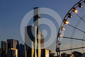 Ferris wheel with city skyline against sunset at Navy Pier,Chicago