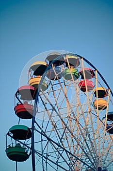 Ferris wheel with color booths, amusement park