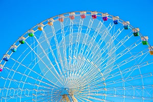 Ferris wheel with colorful cars