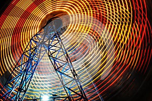 Ferris Wheel at county fair at night, motion blurred