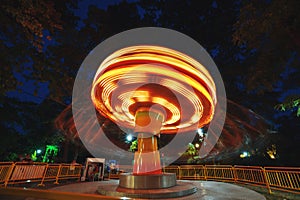 Ferris Wheel at county fair at night, motion blurred