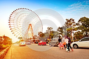 Ferris wheel and the crowd