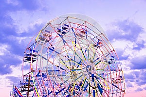 Ferris wheel at a fair in Myanmar at sunset