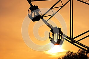Ferris wheel at the fair during the picturesque sunset