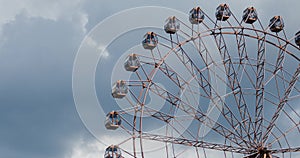 Ferris wheel on fun fair on blue sky white clouds background, timelapse video.
