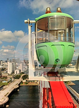 Ferris wheel green cabin gondolas closeup. Tokyo, Japan