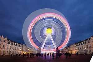 A Ferris Wheel illuminates the Night Stuttgart Germany